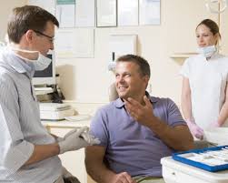 State-of-the-art gingival (gum) surgical techniques at Farber Center being discussed with a patient.