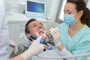 man visiting the dentist