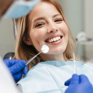 patient being examined during a dental cleaning